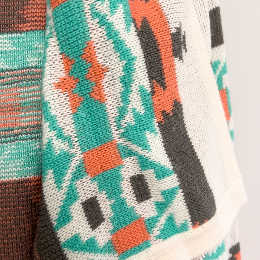 Multicolored patterned sweater.